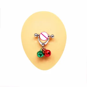 Close-up of stainless steel nipple ring with festive red and green hanging bells
