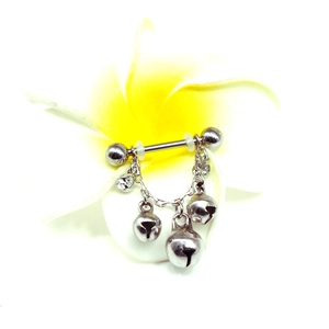 Barbell nipple ring with silver bells and sparkling crystals on a white floral background