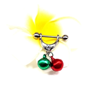Detailed view of silver nipple ring with red and green bells and a clear zircon stone