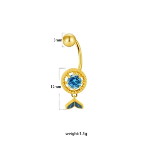 Macro shot of gold navel ring with blue gemstone and gradient fishtail pendant details