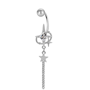 Macro shot of silver navel ring with square zirconia stone and star chain detail