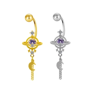 Saturn belly rings in gold and silver with purple stones and moon pendants on white background