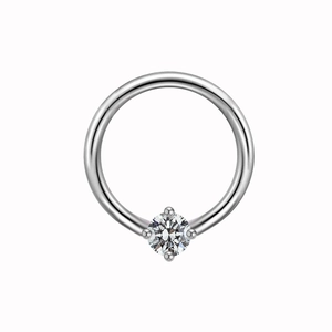 Close-up of a silver nipple ring featuring a clear zircon stone with four-prong setting