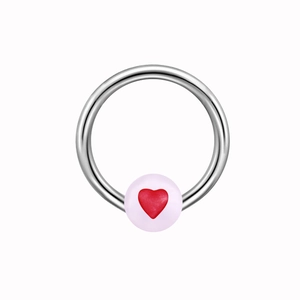 Macro detail of silver captive bead ring with red heart glow bead ornament