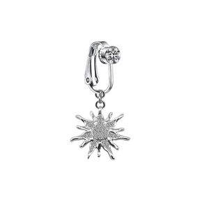 Macro detail of silver non-pierced navel clip with sparkling zircon sunflower pendant