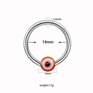 Detailed view of silver nipple ring with evil eye bead showing 14mm inner diameter size