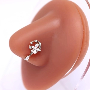 Macro view of silver floral nose ring with marquise cubic zirconia on silicone model