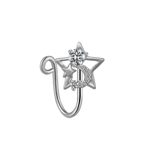Detail of silver nose ring with star and moon design featuring clear zircon stones