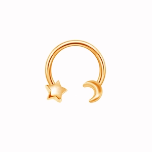 Detail of rose gold nose ring featuring polished star and crescent moon elements