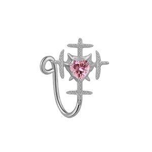 Close-up of heart-shaped pink zircon nose ring with cross pattern on silver metal