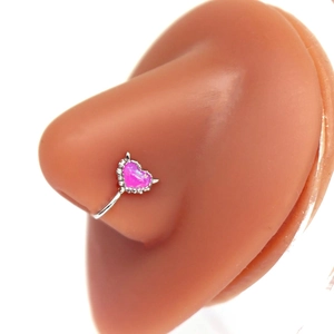 Silver heart nose ring with pink opal and tiny spikes shown on a silicone model
