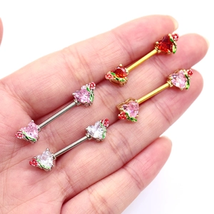 Detailed shot of heart-shaped zircon nipple rings with tiny rose and leaf carvings
