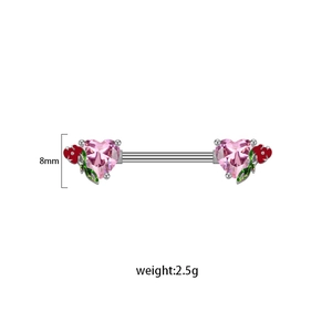 Macro detail of heart-shaped pink zircon nipple ring with floral enamel accents