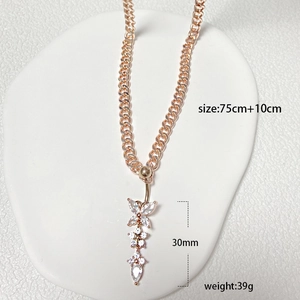 Detail of rose gold belly chain with crystal butterfly pendant and measurement data