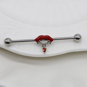 Industrial Barbell Schmuck mit Vampirlippen und orangefarbenem Zirkonia Herzanhänger