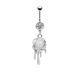 Close-up of heart navel ring with melting liquid metal effect and white pearl detail