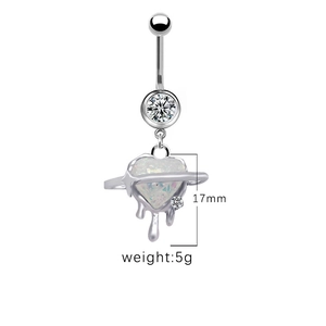 Detailed view of heart planet navel ring with opal stone and liquid metal drip drop