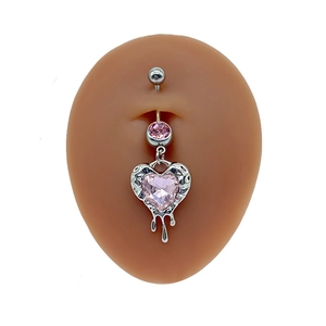 Silver belly button ring featuring a pink heart crystal with liquid lava metal drips