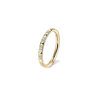 Golden titanium heart opal ring with studded texture and crystals on white background