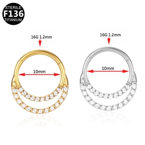 Detail of 16G F136 titanium septum clicker with double rows of white zircons and opal