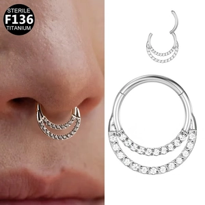 Close-up of F136 titanium nose ring with double-row sparkling cubic zirconia and opal