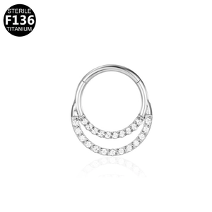 Detailed macro of a sterile F136 titanium double ring with double rows of white zircon stones