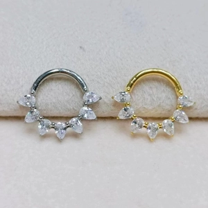 Titanium hoop nose rings with teardrop cubic zirconia in gold and silver finish