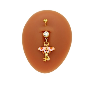 Detail of golden belly ring with colorful butterfly pendant and sparkling zircon on model