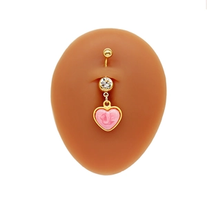 Detailed view of heart-shaped belly ring with pink marble resin on silicone navel model