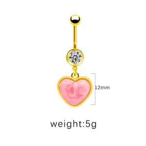 Detailed view of golden navel ring with pink heart pendant and clear zircon inlay