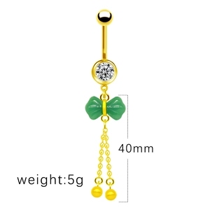 Detailed view of golden navel ring featuring green butterfly and 40mm long chain tassels