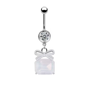 Detail view of heart bow belly ring with silver post and white gemstone accents