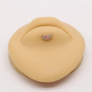 Detailed macro view of heart-shaped pink zircon labret stud on a realistic skin model