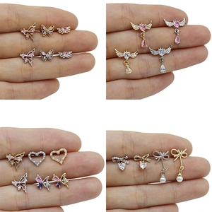 Luxury heart with wings and butterfly zircon cartilage earrings set in gold and silver
