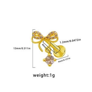 Macro detail of gold bow labret stud with white zircon showing precise dimensions and scale