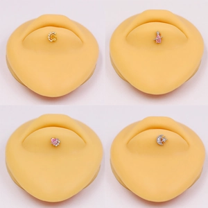 Star and moon celestial lip piercings set with pink and white cubic zirconia accents