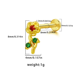 Detailed view of flower-shaped stud earring with red and green cubic zirconia stones