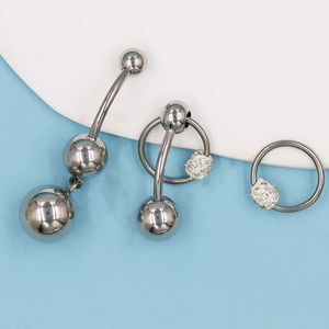 Set de tres piercings para ombligo de acero inoxidable con bolas de cristal pavimentado