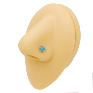 Silver moon-shaped nose stud with blue turquoise stones shown on a silicone model