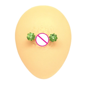 Green clover piercing nipple ring set in silver stainless steel on model display