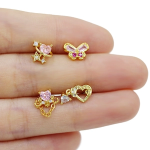 Set of four gold heart and butterfly nose studs with pink zircon and dangling chains