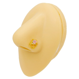 Detail view of heart-shaped pink zircon nose stud with gold chain on a silicone model