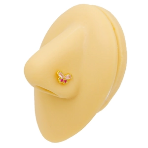 Golden butterfly nose stud with pink rectangular zircon and red stones on a model