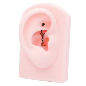 Gothic bat-style heart and pear-cut red zircon ear stud in black stainless steel