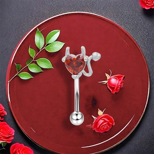 Minimalist red heart devil barbell piercing with silver horns and tail on floral base