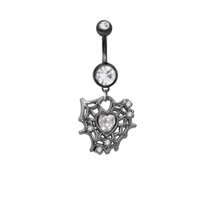 Close-up of gothic spider web navel ring with heart-shaped crystal on white background