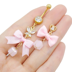 Golden bow belly button ring with pink zircon heart and ribbon dangle jewelry