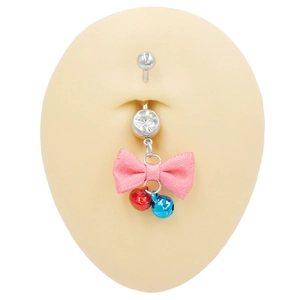 Detail of belly button ring with pink ribbon bow and colorful small jingle bells
