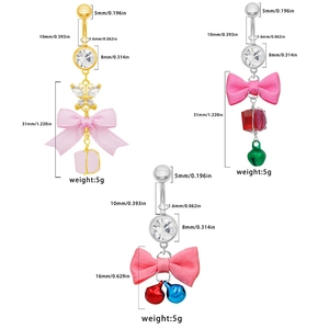 Detailed view of handmade bow belly rings with colorful bells and zircon stones