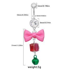 Silver belly button ring with pink bow, red gemstone, and green bell pendant on white background
